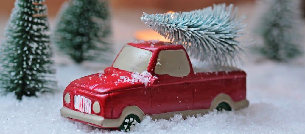 toy truck with fake pine trees and fake snow