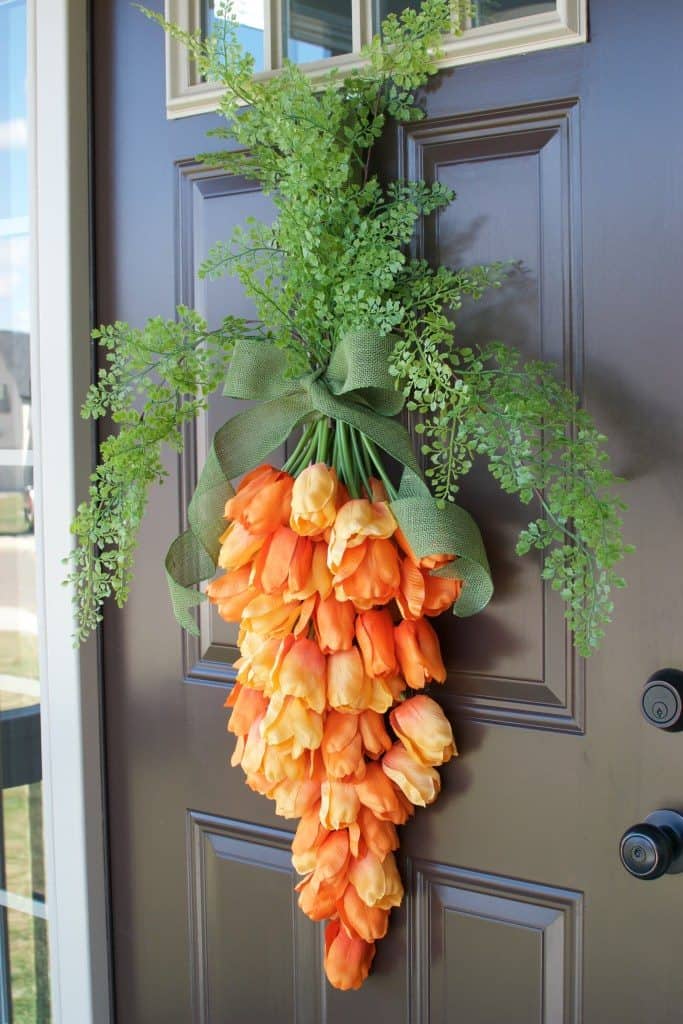 orange tulip flowers turned into carrot shaped door decoration diy easter decoration